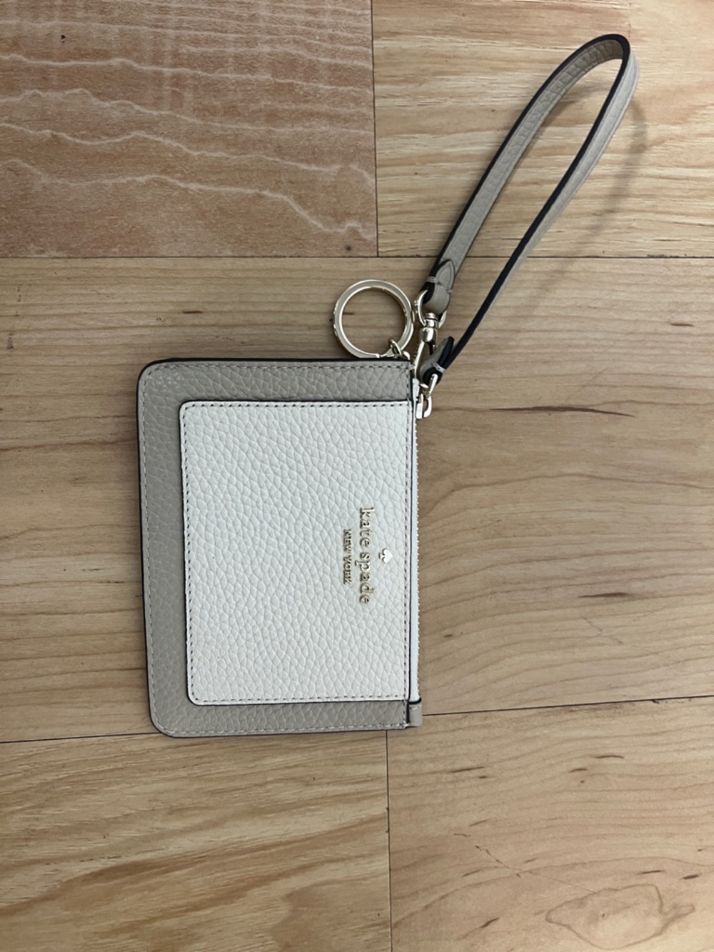 kate spade two-tone pebble leather wristlet in white and light gray
